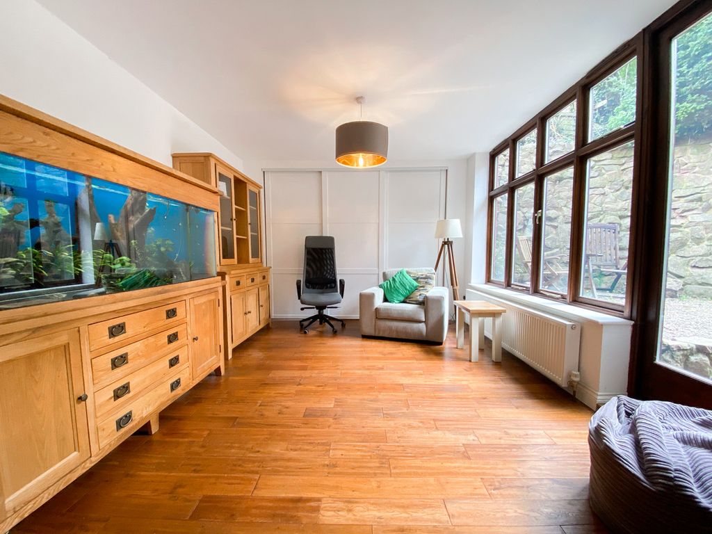 The sunroom with full width cupboard