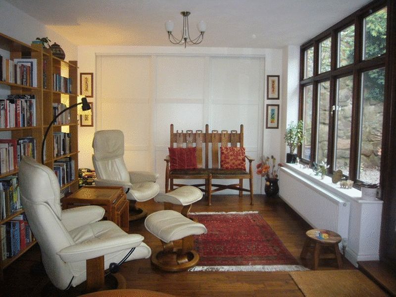 The Sun-Room with full width cupboard