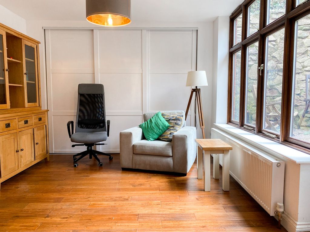 The sunroom with full width cupboard
