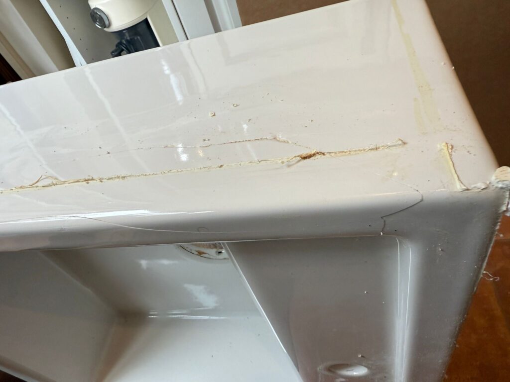 The removed sink showing the source of the crack on the side