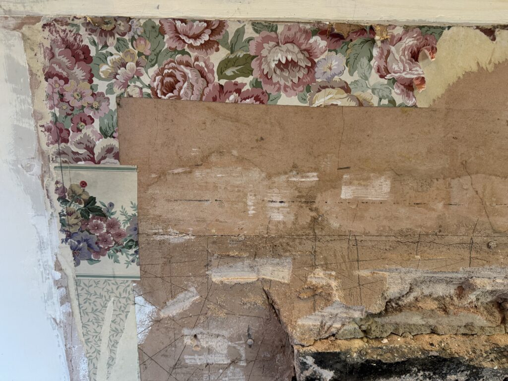 Old lounge wallpaper found behind the now removed fireplace