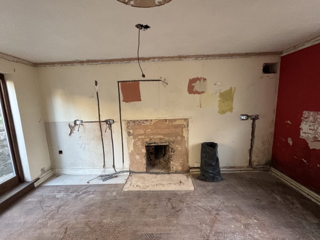 The fireplace wall stripped, flooring removed