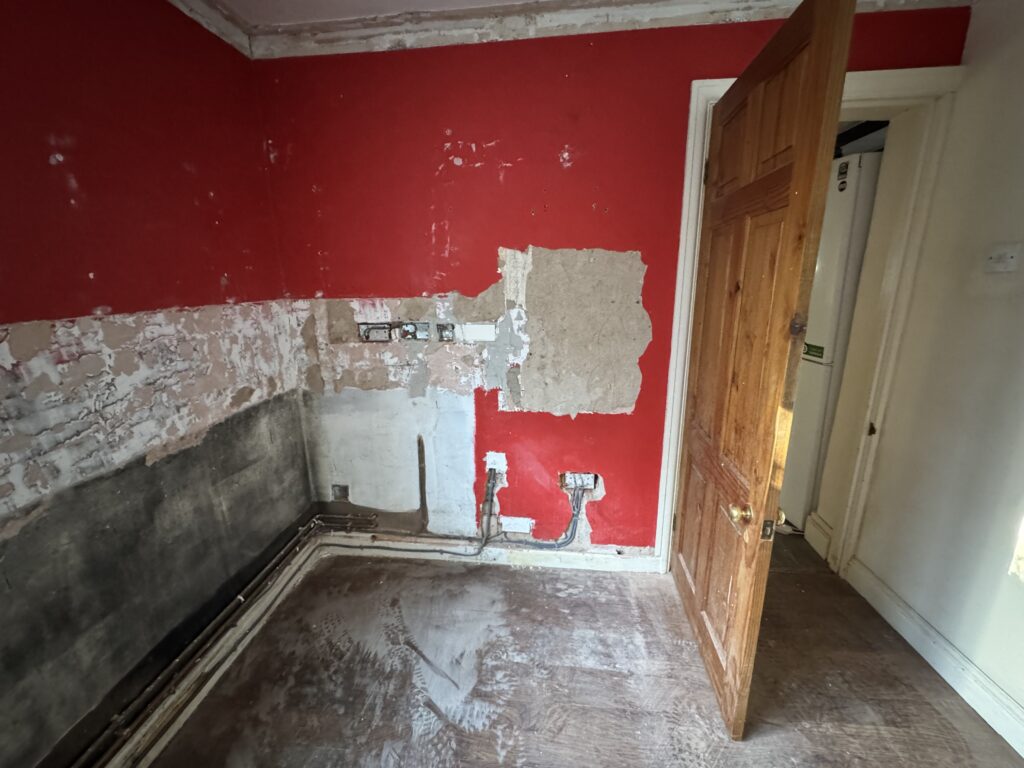 Cooker wall stripped, flooring removed