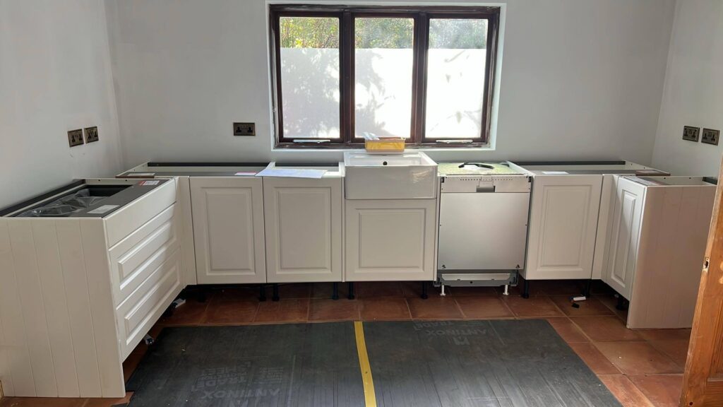 The sink and fitted dishwasher in place